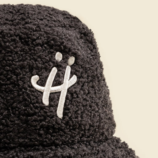 "The signature H" black bucket hat
