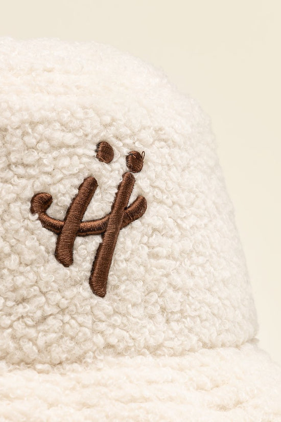 "The signature H" beige bucket hat