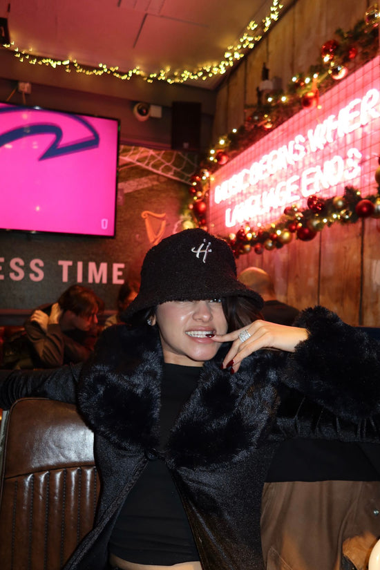"The signature H" black bucket hat