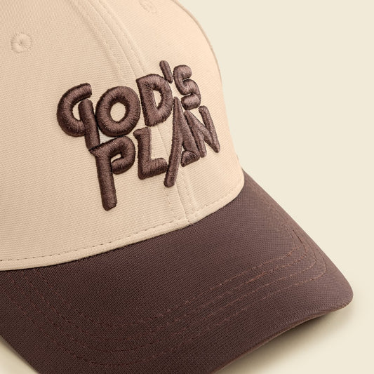 Beige and brown cap with 'God's Plan' text on a beige background